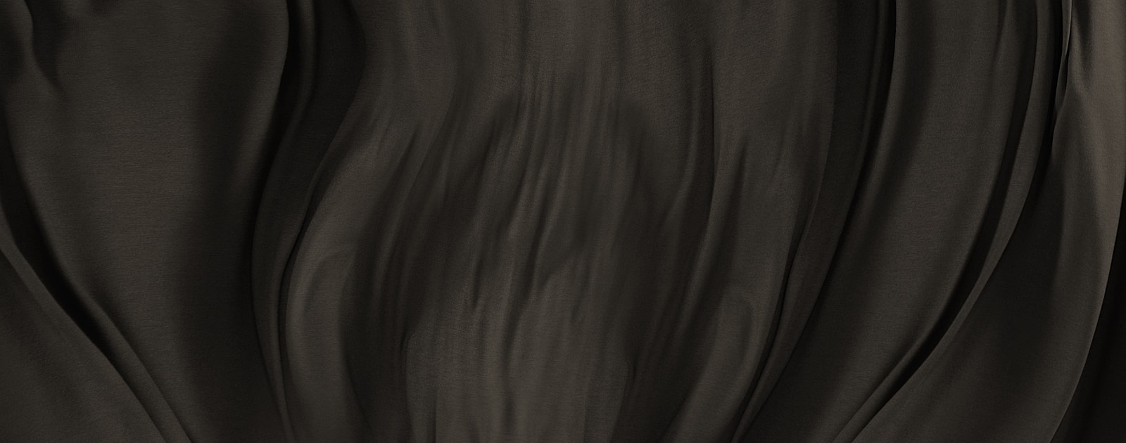 Dark, flowing fabric texture background.