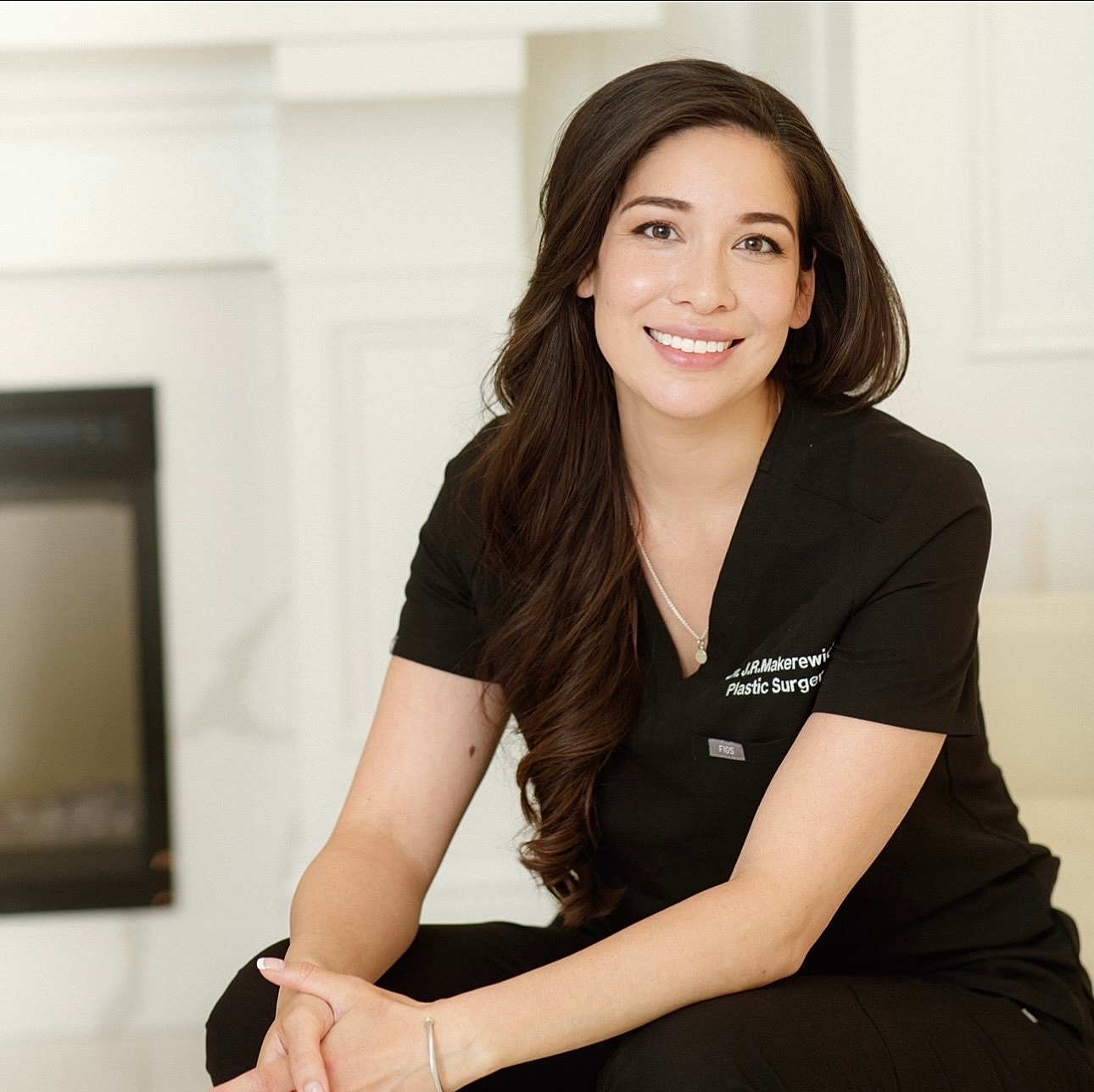Smiling woman with long hair and shadows.